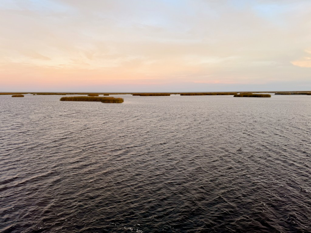 A vast lake at sunset.
